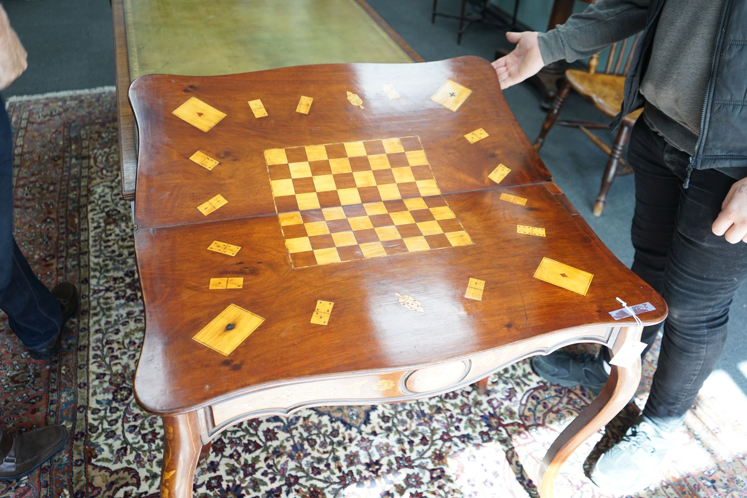 A 19th century Dutch mahogany and marquetry games table, width 85cm depth 43cm height 75cm